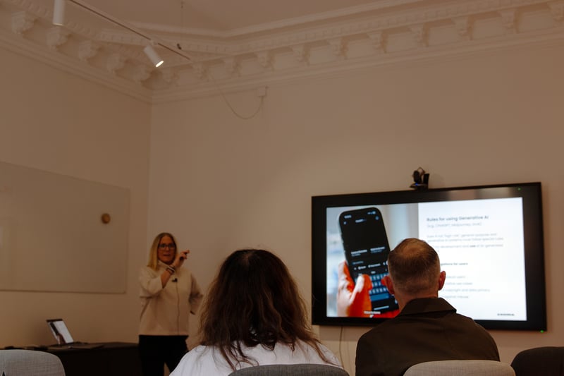 Woman presenting a slide show to an audience